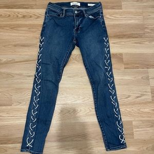 Pacsun super stretch jeans with cross threads on the sides